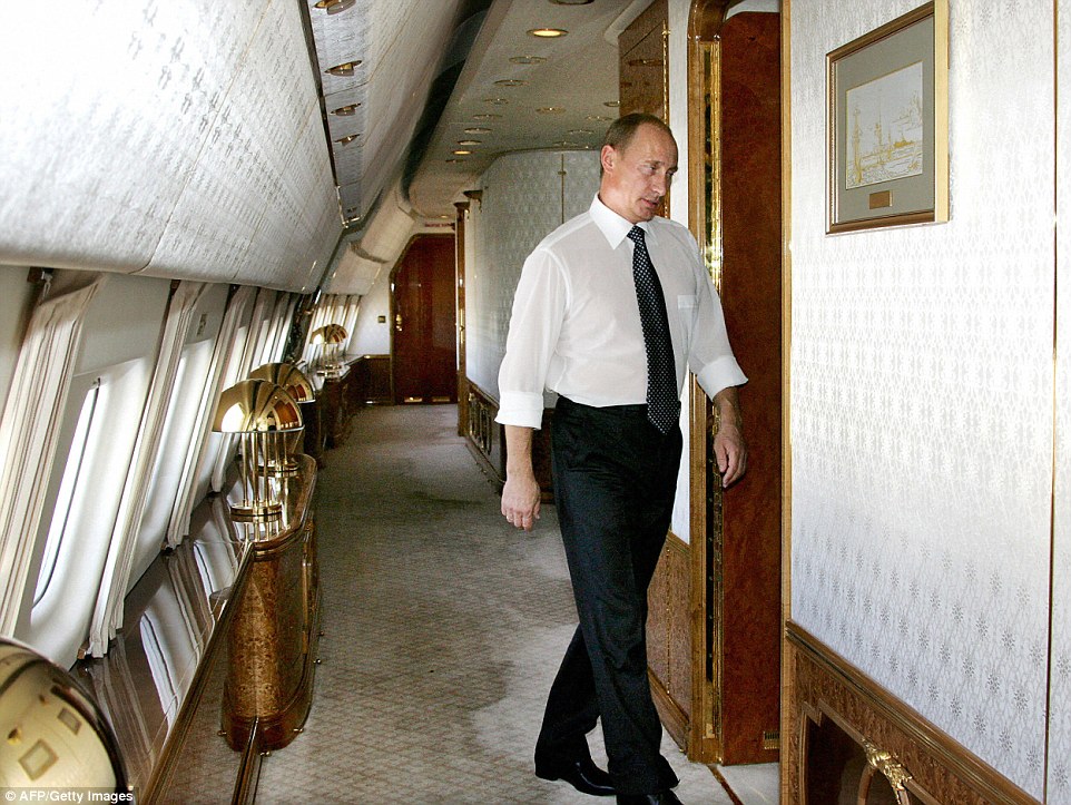 Putin pictured on a previous presidential plane in 2006 after a visit to Casablanca. He can be seen walking down an ornate corridorÂ 